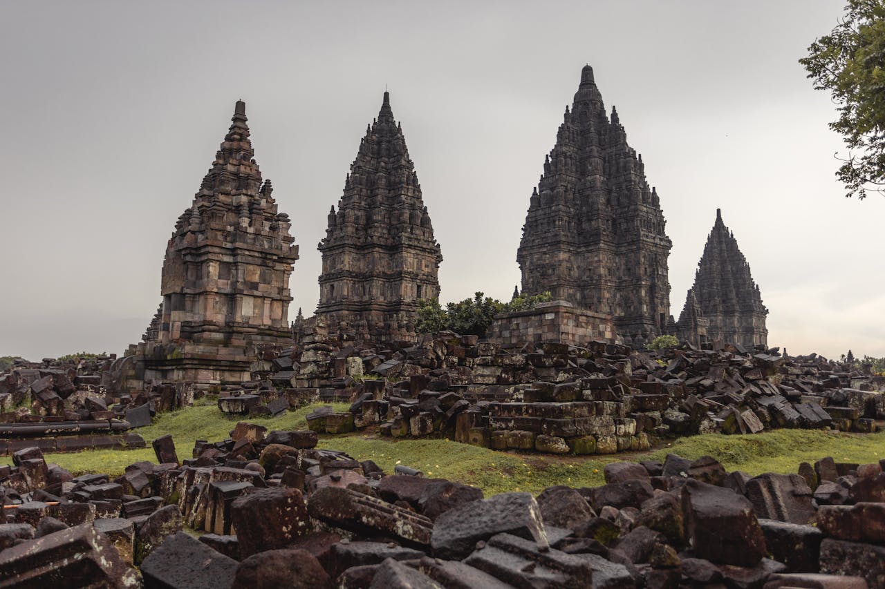 Low angle of ancient Prambanan Hindu temple against sunset sky located on territory of archaeological park in Indonesia